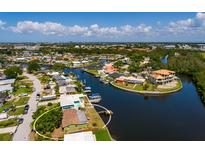 Waterfront home featuring a boat dock and beautiful water views in a desirable coastal community at 9439 Sun Isle Ne Dr, St Petersburg, FL 33702