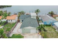 Charming waterfront home featuring a well-maintained yard and convenient garage access at 1022 Canal St, Ruskin, FL 33570