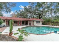 Backyard pool featuring brick trim and access to the home, creating a relaxing outdoor retreat at 1545 Park N St, St Petersburg, FL 33710