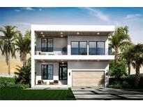 Striking two-story modern home with a flat roof, a two car garage, and front yard seating at 2517 N Riverside Dr, Tampa, FL 33602