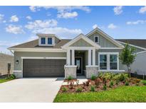 Charming single-Gathering home with a two-car garage and beautifully landscaped front yard at 5289 Everlong Dr, Apollo Beach, FL 33572