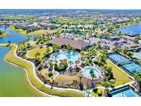 An aerial shot of a community pool, complete with pools, and landscaping at 5426 Rushmere Ct, Palmetto, FL 34221