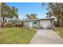 Charming single-story home with a well-maintained lawn and inviting curb appeal at 1415 Ridge Ave, Clearwater, FL 33755