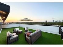 Inviting rooftop deck features lounge seating, perfect for enjoying panoramic city views and outdoor relaxation at 2116 4Th S St, St Petersburg, FL 33705