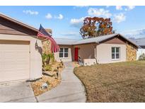 Charming single-Gathering home featuring stone accents, tidy landscaping, and inviting curb appeal at 11001 Hobson St, Spring Hill, FL 34608