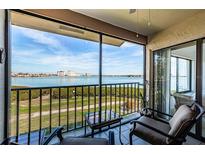 Relax on the screened balcony with seating and stunning water views at 6218 Palma Del Mar S Blvd # 208, St Petersburg, FL 33715