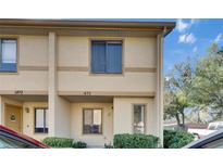 Charming townhome featuring a neutral color scheme, well-maintained landscaping, and a cozy, welcoming facade at 1470 Highland Ridge Cir, Brandon, FL 33510