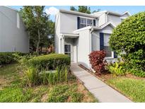 Charming two-story home with blue shutters and a landscaped front yard provides great curb appeal at 6333 Osprey Lake Cir, Riverview, FL 33578