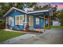 Charming single-Gathering home featuring a quaint covered porch and well-manicured lawn at 1214 E Curtis St, Tampa, FL 33603