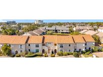Attractive condo featuring a tile roof, well-maintained landscaping, and inviting curb appeal at 13600 Egret Blvd # 204K, Clearwater, FL 33762