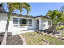 Charming home with freshly painted exterior, large window and meticulous landscaping at 1309 Nokomis S Ave, Venice, FL 34285