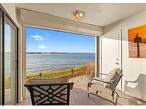 Relaxing patio with comfortable seating and a stunning waterfront view at 6265 Sun Blvd # 101, St Petersburg, FL 33715