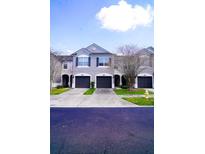 Charming townhomes showcase a well-maintained facade and attached garages at 10217 Westpark Preserve Blvd, Tampa, FL 33625