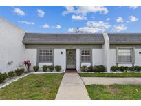 Charming home with a well-maintained front yard and inviting entryway with neutral colors at 4732 Lake Blvd # A, Clearwater, FL 33762