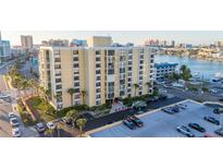 Exterior of the building with palm trees in the front of building and parking spaces available at 800 S Gulfview Blvd # 403, Clearwater Beach, FL 33767