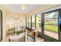 Cozy sunroom featuring tiled floors, ample natural light, and comfortable seating for relaxing and entertaining at 2546 Oakleaf Ln # 35D, Clearwater, FL 33763
