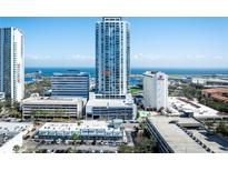 Stunning aerial view of a waterfront high rise with nearby commercial buildings at 301 1St S St # 1605, St Petersburg, FL 33701