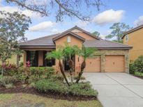 Charming single-story home with a well-manicured front yard and a two-car garage at 20312 Heritage Point Dr, Tampa, FL 33647