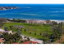 Beautiful aerial view featuring the pristine beach, lush greenery, and calm bay waters at 1200 N Shore Ne Dr # 204, St Petersburg, FL 33701