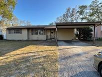 Charming single-story home with a covered carport and a well-maintained front yard at 2120 57Th N Ave, St Petersburg, FL 33714