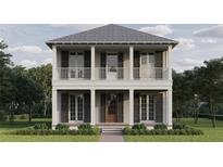 Charming two-story home featuring a classic double porch design and a well-manicured front lawn at 1119 26Th N Ave, St Petersburg, FL 33704