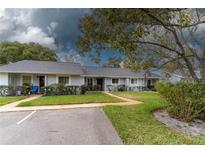 Charming single-story villa with well-maintained lawn and mature trees at 12227 Darwood Dr # 0, Hudson, FL 34667