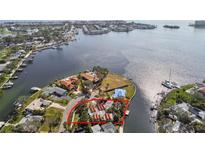 Aerial view of waterfront property with lush landscaping and panoramic water views in desirable neighborhood at 4811 Paradise S Way, St Petersburg, FL 33705