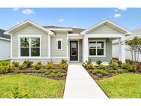 Charming single-Gathering home with well-manicured lawn and lush landscaping at 28784 Rambutan Dr, Wesley Chapel, FL 33543