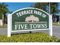 Terrace Park of Five Towns community sign with lush landscaping below on a sunny day at 8199 Terrace Garden N Dr # 212, St Petersburg, FL 33709