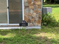 Close up of house number sign and stone exterior at 3223 Coats Rd, Zephyrhills, FL 33541