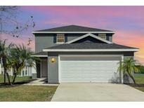 Charming two-story home with a two-car garage and well-maintained landscaping at 1308 22Nd E St, Palmetto, FL 34221
