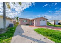 Charming single-Gathering home with a one-car garage and a well-maintained front yard at 5033 Blue Heron Dr, New Port Richey, FL 34652