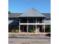 Two-story condominium with stairs, parking area, and covered space on both floors at 200 Country Club Dr # 903, Largo, FL 33771