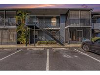 Exterior of the condo with stair access to upper units and convenient parking at 3711 W Iowa Ave # 214, Tampa, FL 33611