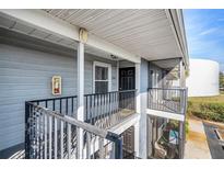 View of the balcony and unit 214 at 3711 W Iowa Ave # 214, Tampa, FL 33611