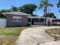 Inviting single-story home with a spacious front yard and a classic driveway, creating a welcoming curb appeal at 1811 Ridge S Rd, Largo, FL 33778