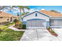 Charming single-story home with a well-manicured lawn and a two-car garage at 1219 Huntington Greens Dr # 1219, Sun City Center, FL 33573