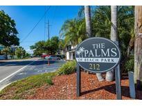 A community sign reads 'The Palms of Beach Park' located at 212 with ample parking spaces at 212 S Church Ave # 208, Tampa, FL 33609