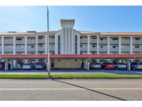 Spacious condo with covered parking and meticulously landscaped grounds in a desirable community at 19029 Us Highway 19 N # 8-15, Clearwater, FL 33764