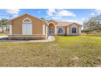 Charming single story home with a well-manicured lawn and a traditional design at 11054 Liberto Rd, Weeki Wachee, FL 34614