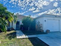 Charming single-story home featuring a well-maintained yard and attached garage at 12139 Buffington Ln, Riverview, FL 33579