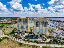 Stunning waterfront condos boast palm trees, marina, and picturesque views at 130 Riviera Dunes Way # 606, Palmetto, FL 34221