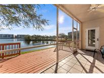 Enjoy the waterfront view from this screened-in patio with a ceiling fan and tile flooring at 6311 99Th N Way # 11B, St Petersburg, FL 33708
