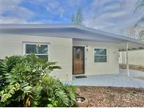 Charming single-story home featuring a well-maintained front yard and a welcoming front door at 721 75Th N Ave, St Petersburg, FL 33702