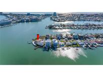 Stunning waterfront home with private dock, lush landscaping, and panoramic water views at 11005 5Th E St, Treasure Island, FL 33706