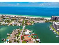 Stunning aerial view of waterfront property with a dock, pool, and Gulf of Mexico access at 205 Harrison Ave, Belleair Beach, FL 33786