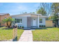 Charming single-story home featuring a well-maintained lawn, modern mailbox, and a welcoming front entrance at 5050 Emerson S Ave, St Petersburg, FL 33707