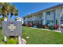 Well-maintained condo complex with lush landscaping and a welcoming entrance sign at 4400 37Th S St # 2, St Petersburg, FL 33711