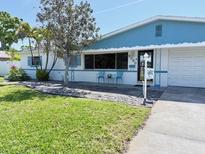 Charming single-story home with well-maintained lawn, tidy landscaping, and inviting curb appeal at 6398 17Th N Pl, St Petersburg, FL 33710