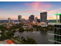 Sunset view of a city skyline and waterfront from a high-rise balcony at 777 3Rd N Ave # 805, St Petersburg, FL 33701